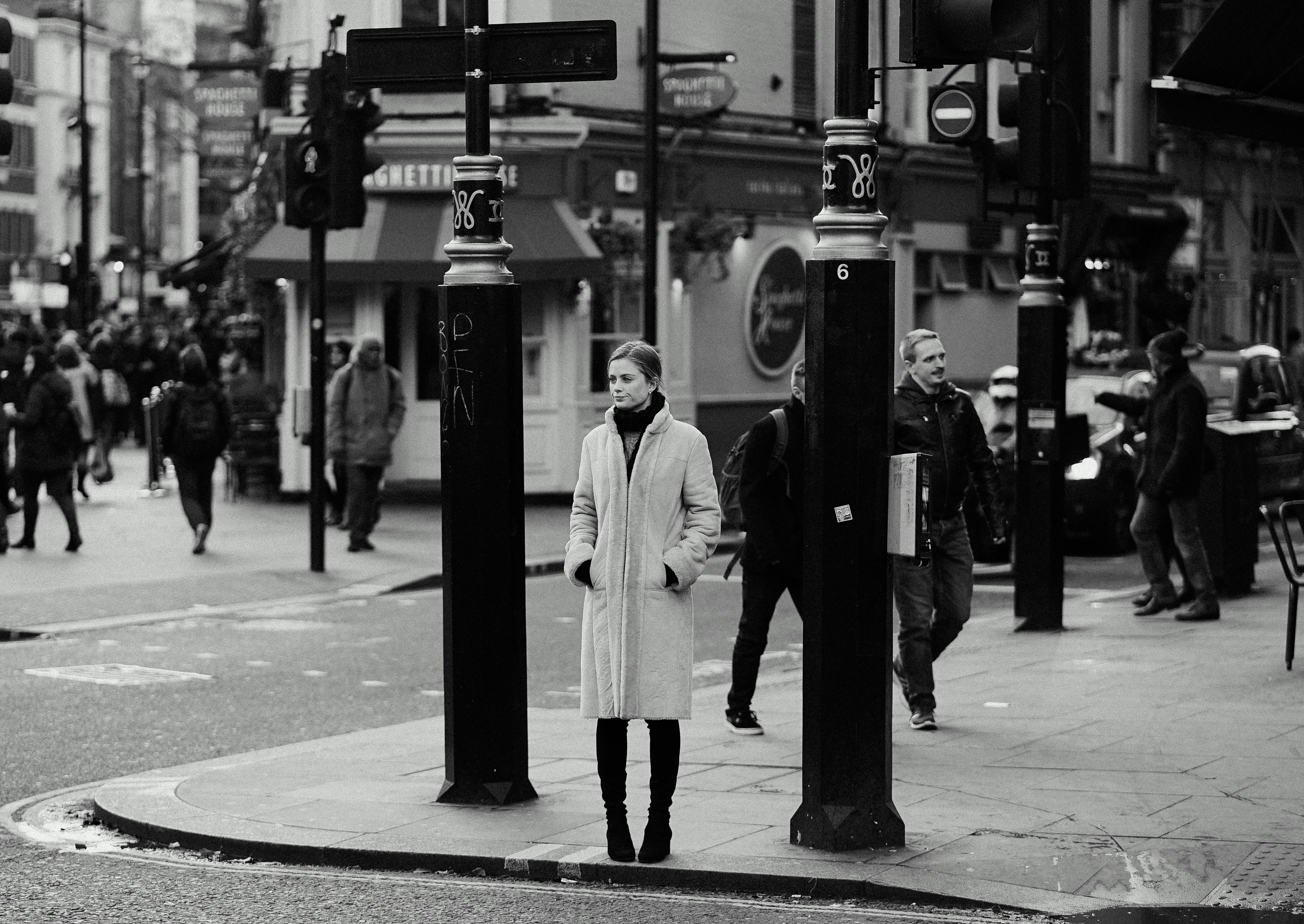 grayscale photography of people walking on street during daytime