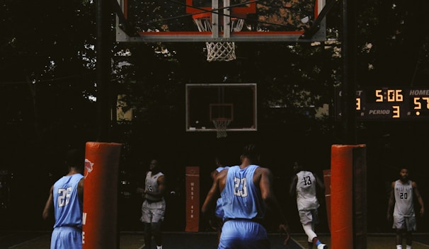The scoreboard showing a close score with minutes ticking down in an intense match.