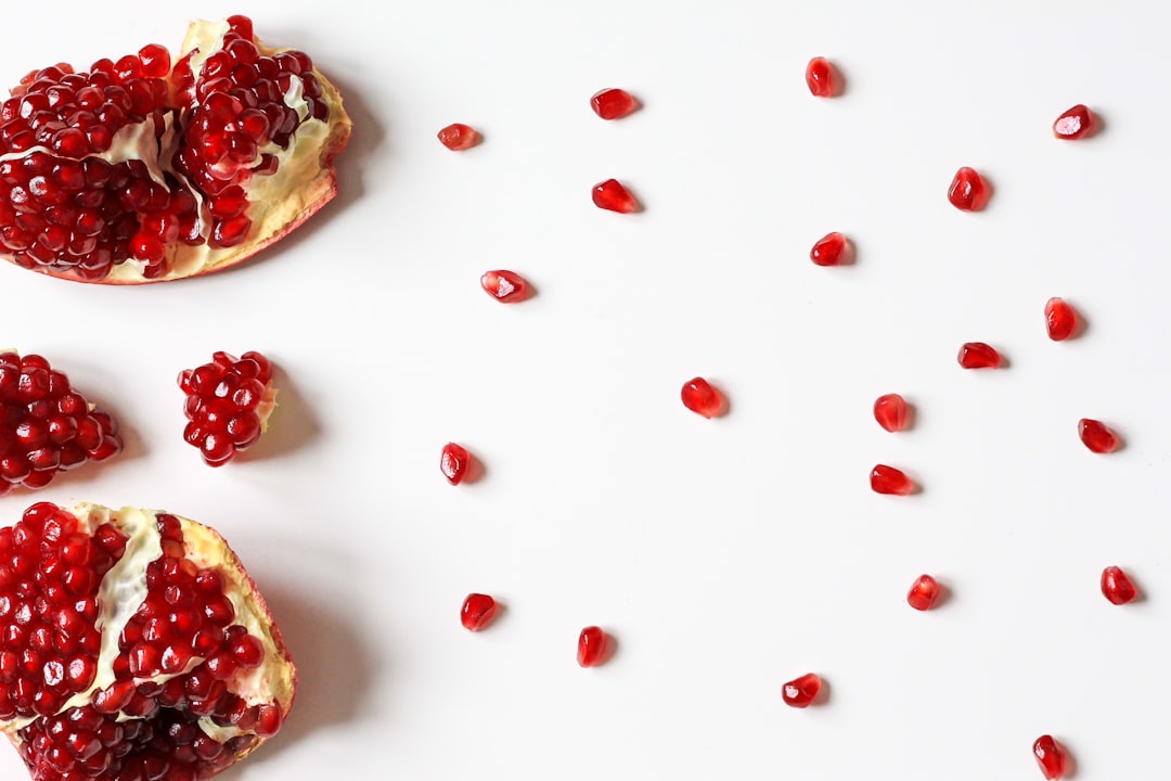 closeup photo of sliced pomegranate fruit