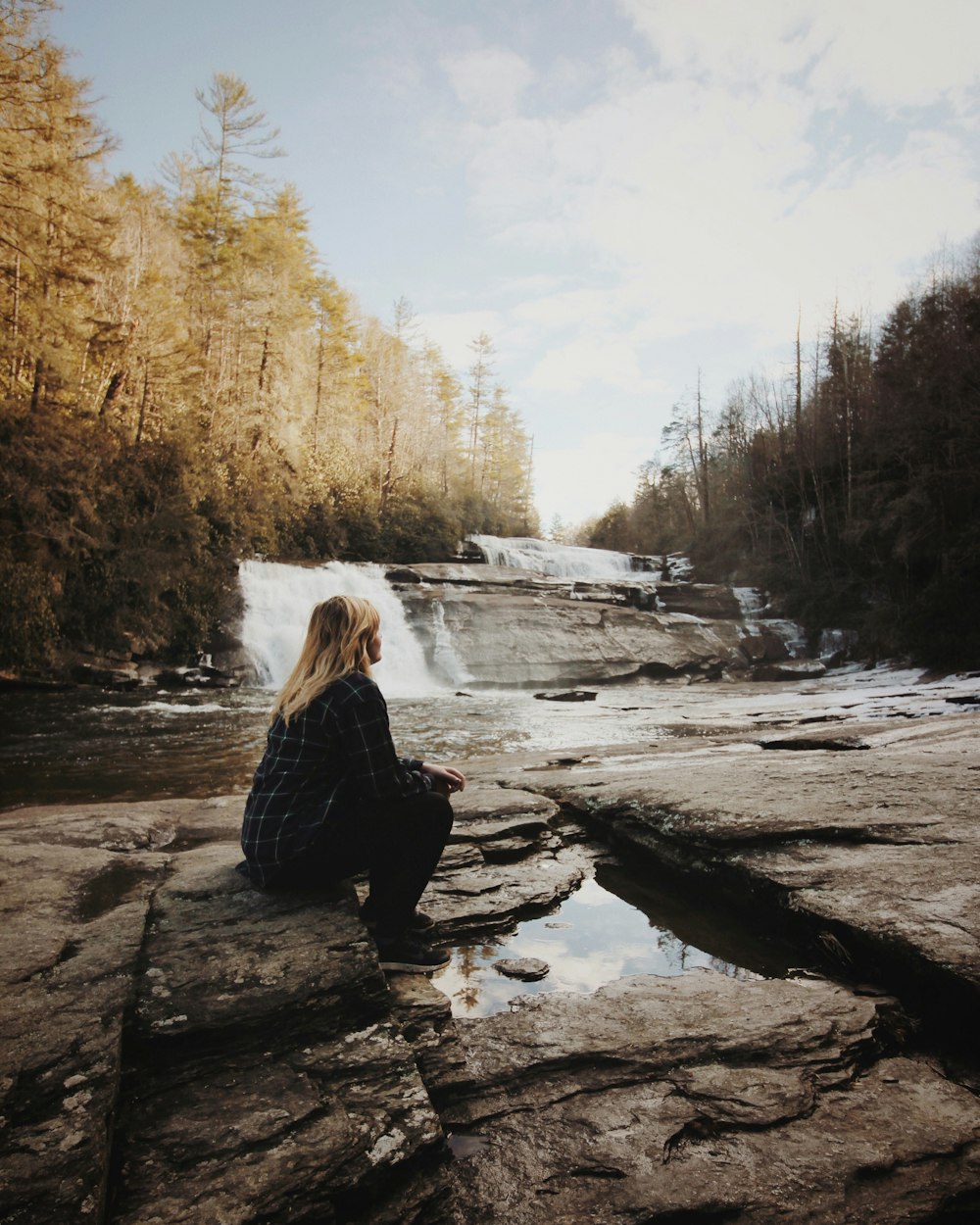 woman sitting near falls