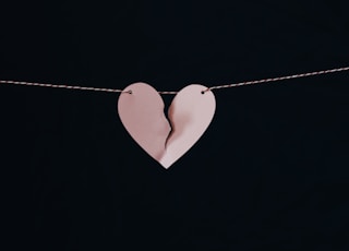 broken heart hanging on wire