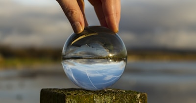 Shelley gently holding a crystal ball, surrounded by mystical decor.