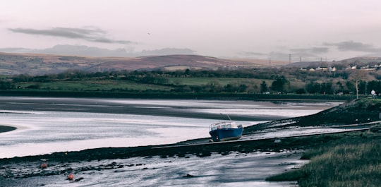 landscape photography of speed boat near body of water in Loughor Bridge United Kingdom