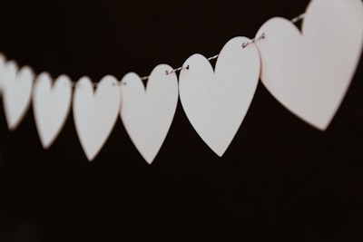 closeup photo of white heart bunting string google meet background
