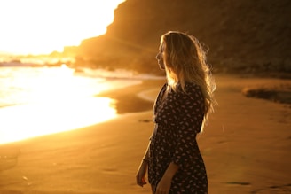 woman standing near body of water