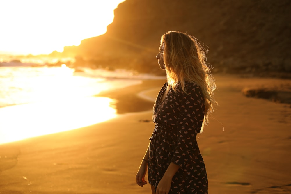 woman standing near body of water