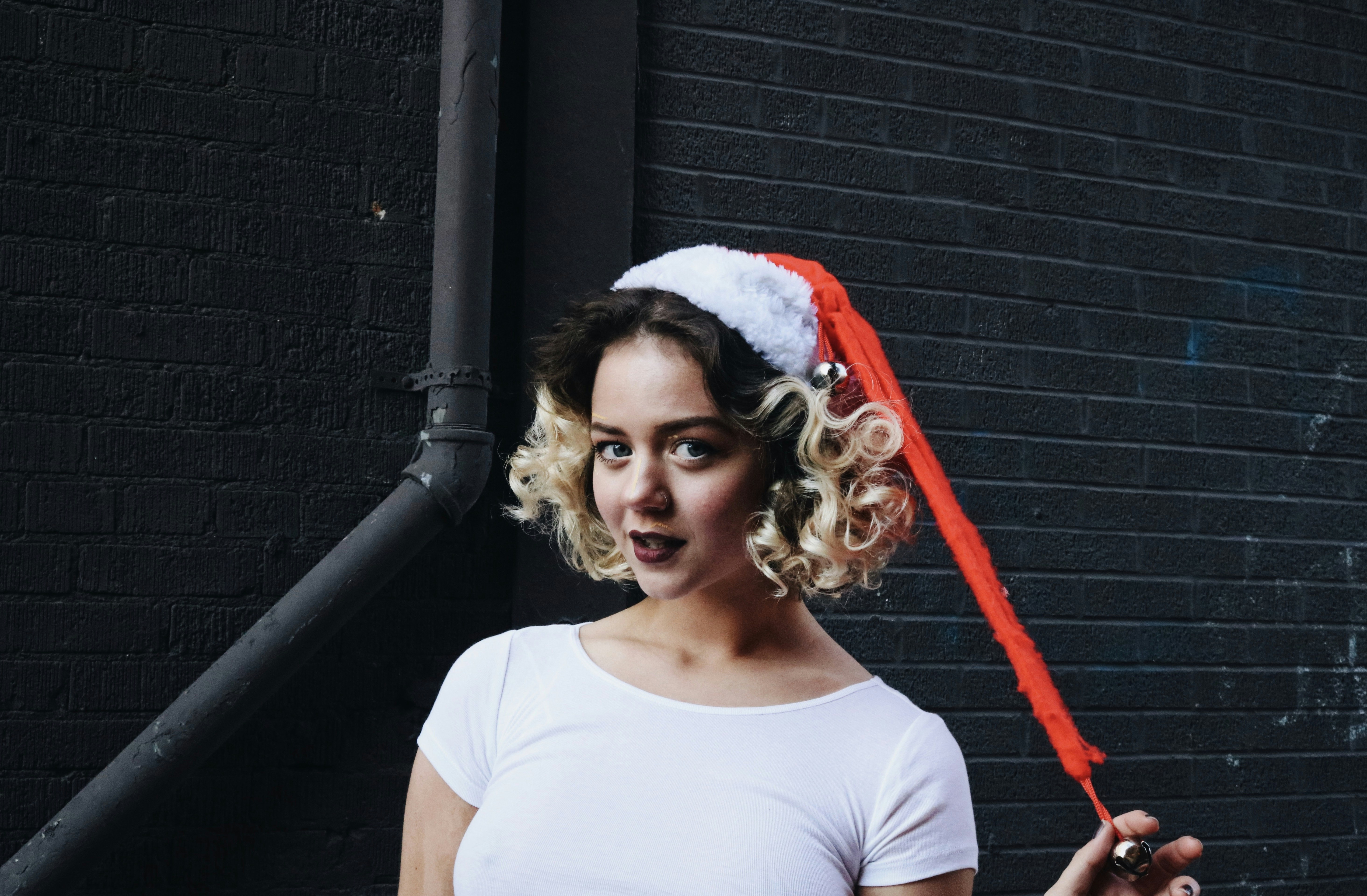 woman standing near gray wall
