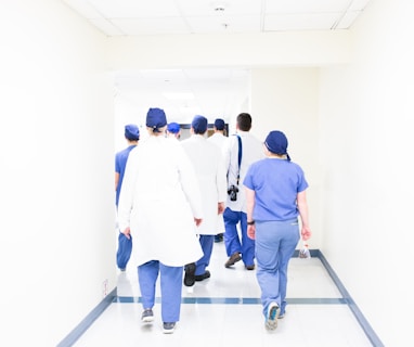 group of doctors walking on hospital hallway