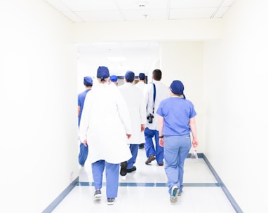 group of doctors walking on hospital hallway