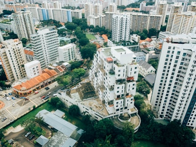 Aerial view of a vibrant cityscape showcasing various residential buildings.