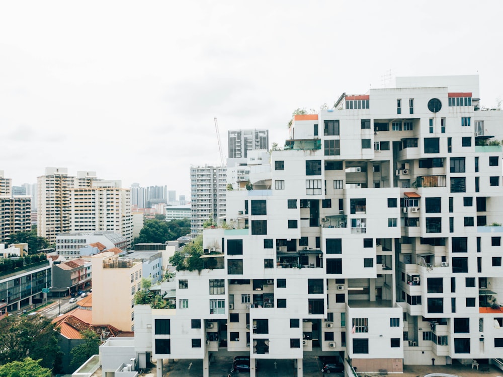 photo of white high-rise buildings