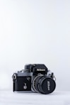 black Nikon camera against white background