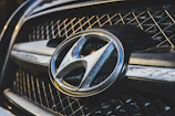 Hyundai emblem shining under showroom lights