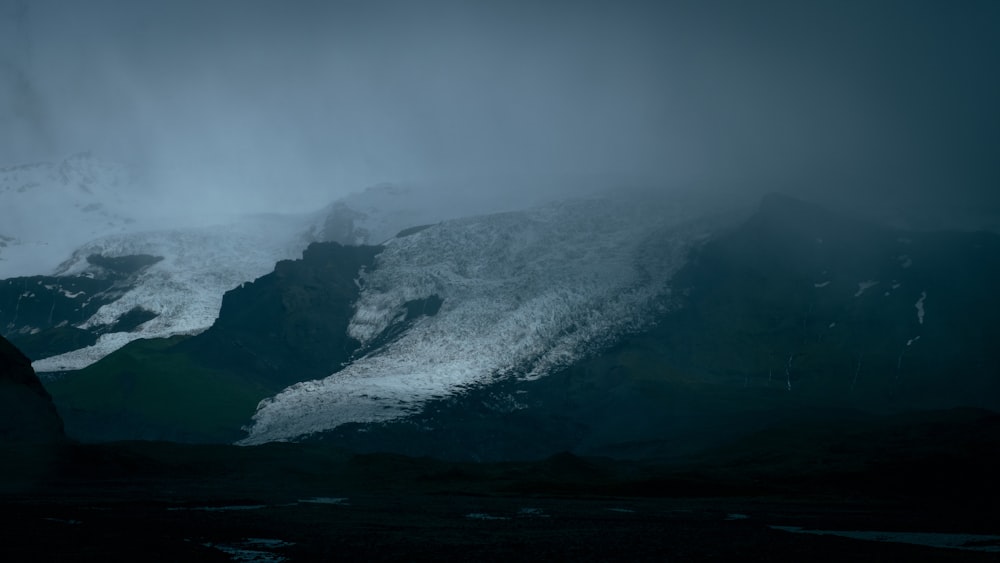 aerial view of mountain coated snow