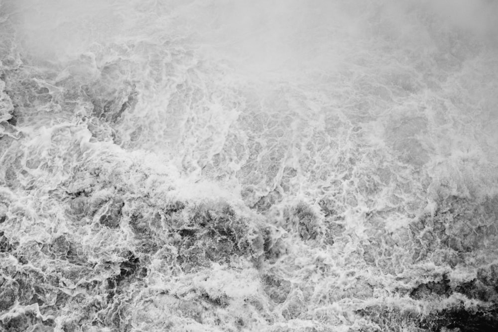 grayscale photograph of rushing water