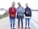 A diverse group of young adults wearing casual streetwear, walking confidently in an urban setting.