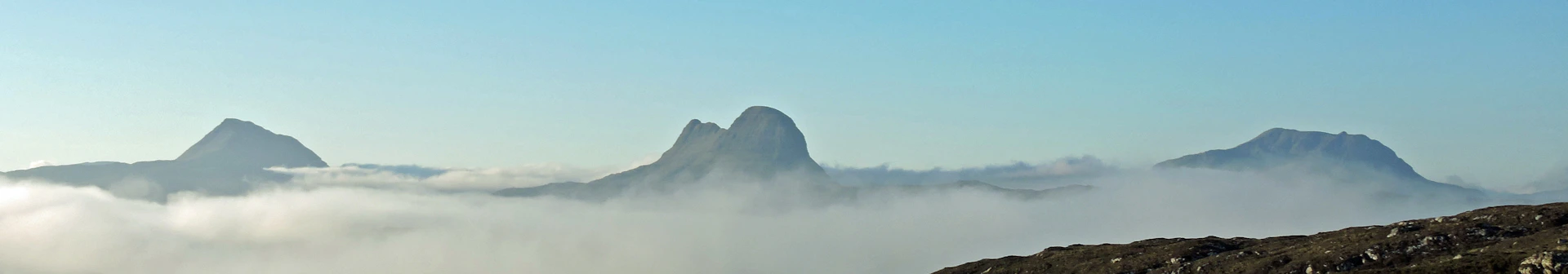 woman wearing yellow long-sleeved dress under white clouds and blue sky during daytime