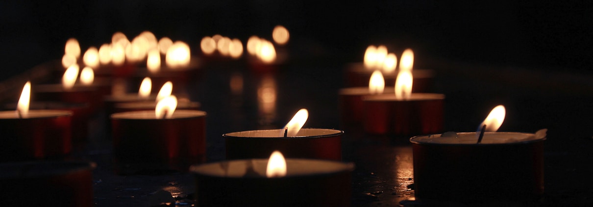 photo of lighted tealight candles