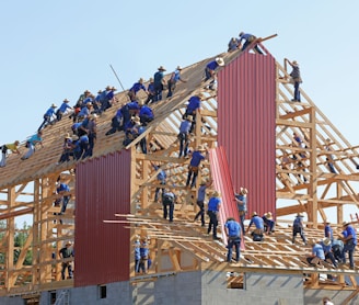 people building structure during daytime