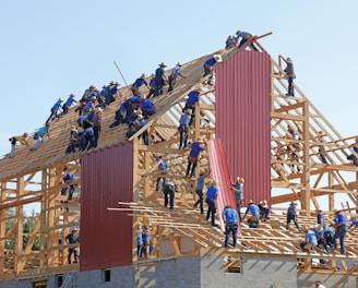 people building structure during daytime