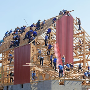 people building structure during daytime