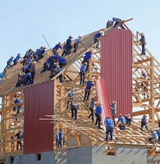 people building structure during daytime