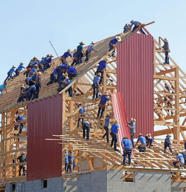 people building structure during daytime