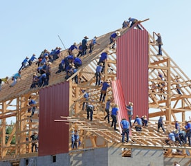 people building structure during daytime