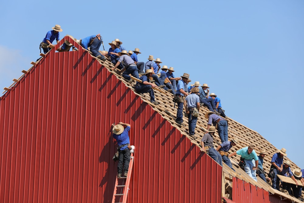 group of construction workers constructing house