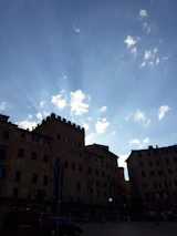 Sunlight falling on the historic architecture of a charming Spanish town square.