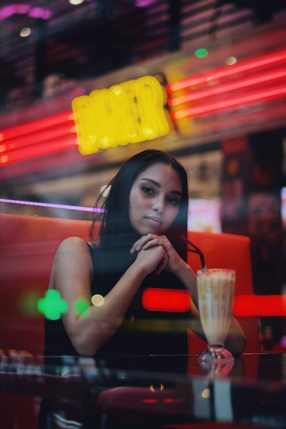 woman in front of shake in pilsner glass