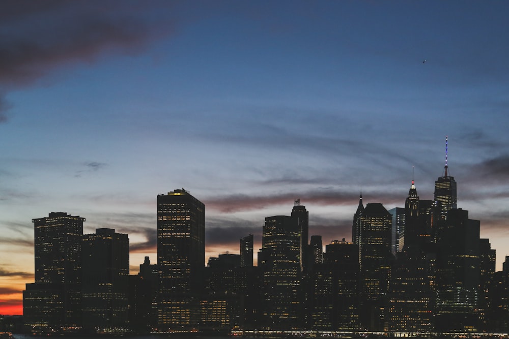 high-rise buildings under the cloudy sky