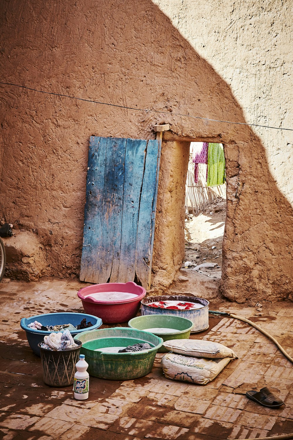 laundry in plastic basins