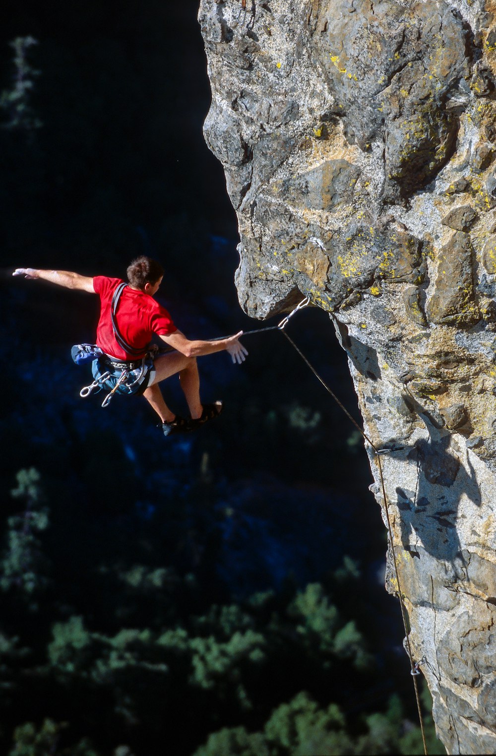 person rock climbing