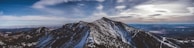 A panoramic shot of the Spiti Valley’s rugged landscape under a dramatic sky.