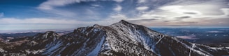 A panoramic view of mountains under a dramatic sky
