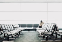 man sitting on gang chair