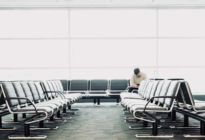 man sitting on gang chair