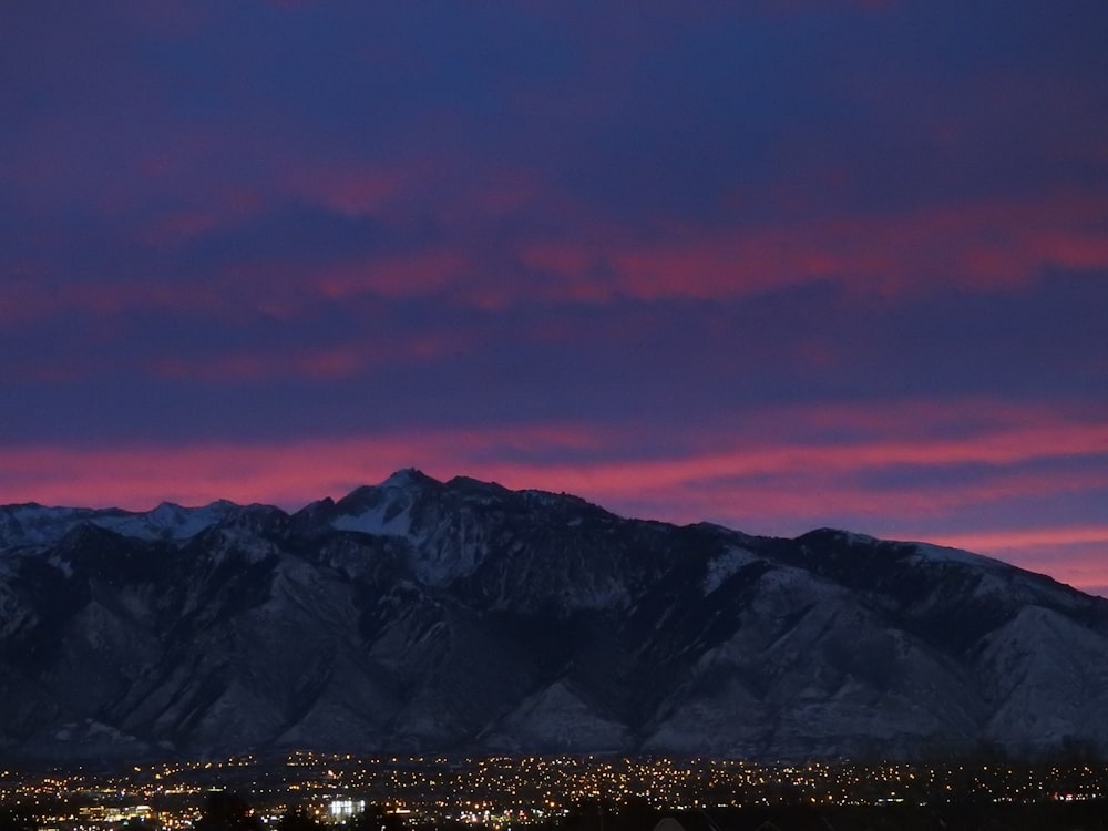 landscape photo of city distant with mountain