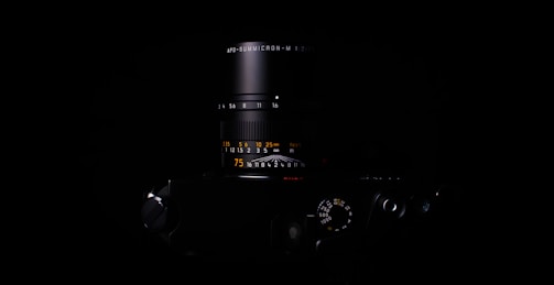 Close-up of precision lenses being inspected with specialized tools