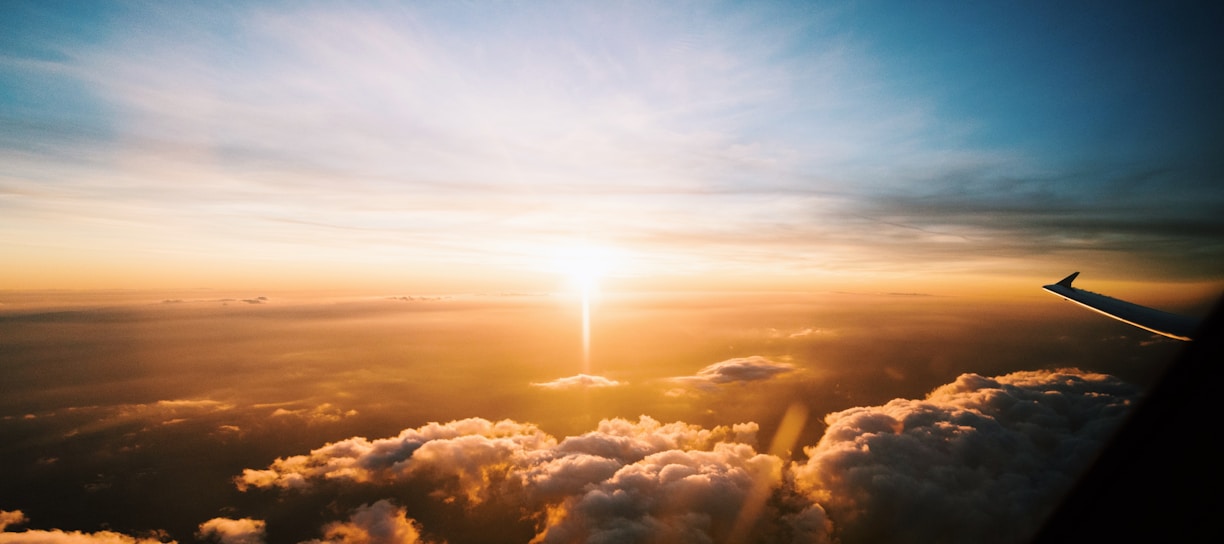 aerial view of sea of clouds during sunset