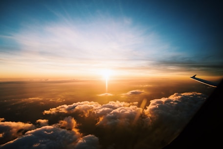 aerial view of sea of clouds during sunset