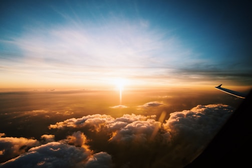 aerial view of sea of clouds during sunset