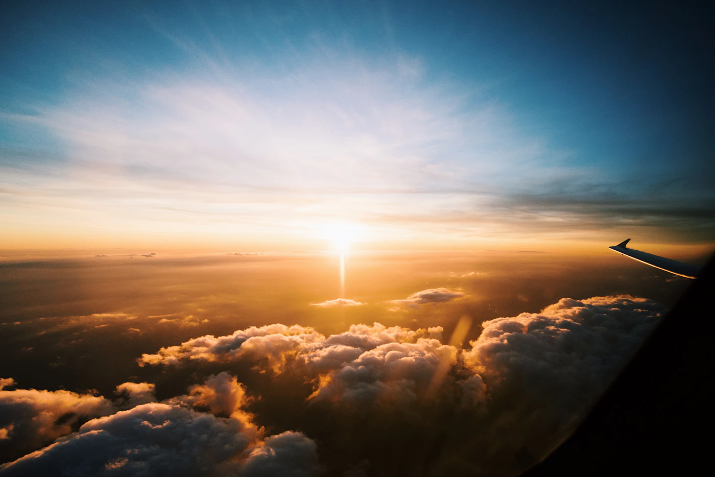 Above the clouds at sunset