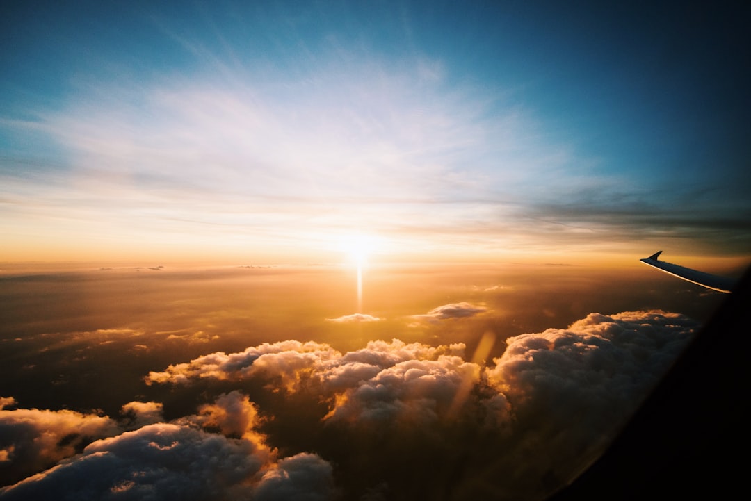 aerial view of sea of clouds during sunset