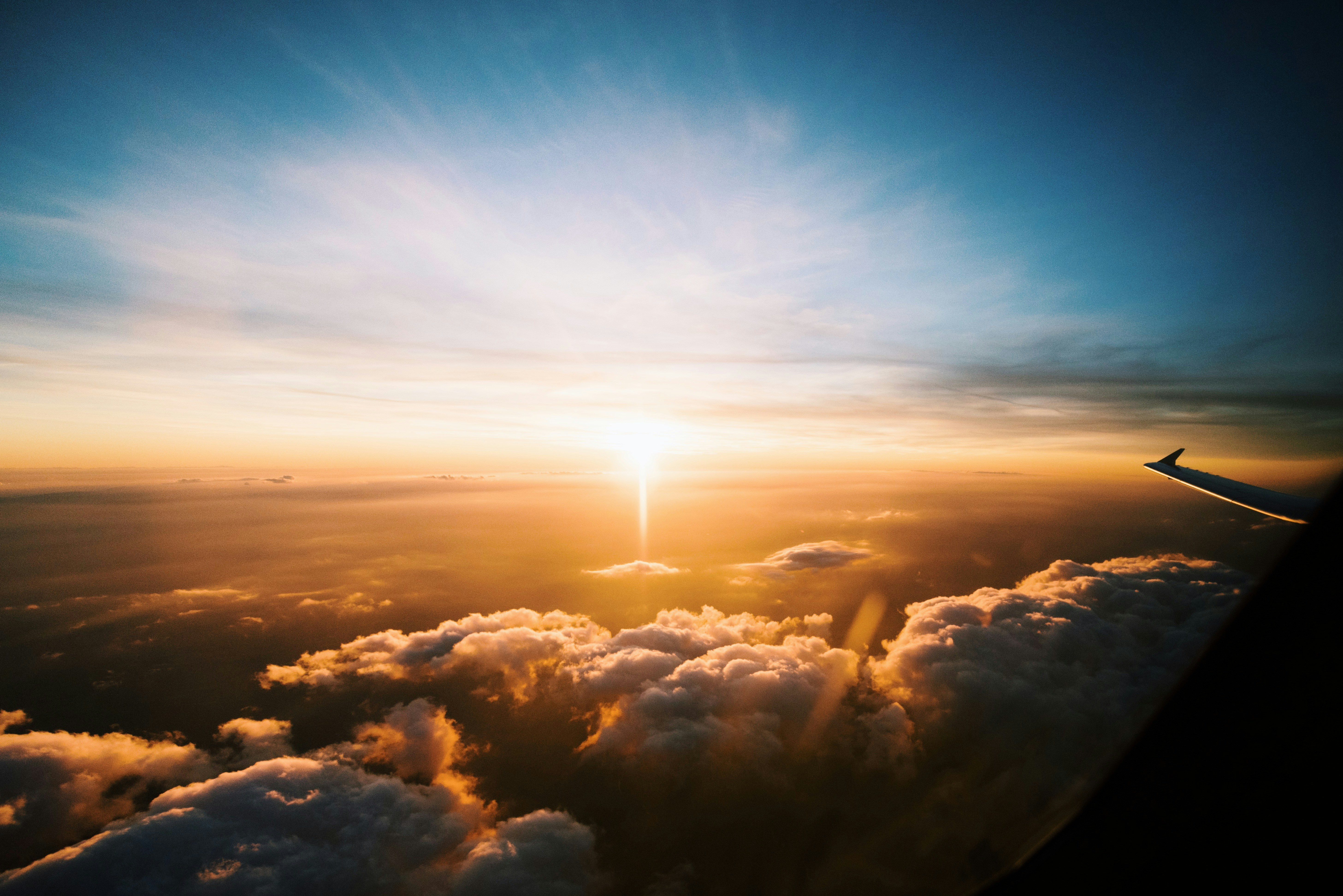 aerial view of sea of clouds during sunset