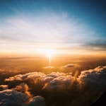 aerial view of sea of clouds during sunset