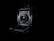A vintage camera is prominently displayed against a dark background, showcasing its intricate mechanical details and lens at the center. The lighting highlights the contours and design of the camera, emphasizing its classic and historical appearance.