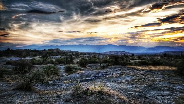 Sunset over the rugged mountains of Patagonia with a lone traveler on Ruta 40
