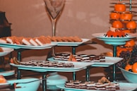 A close-up of a dessert platter featuring assorted sweets and fresh fruit.